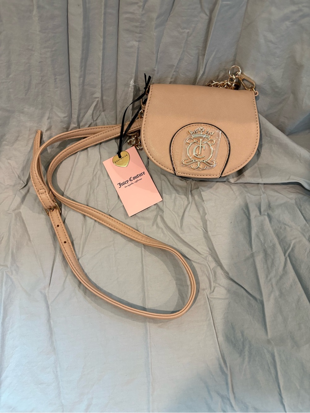Juicy Couture Buff Beige Royal Crest Mini Rounded Flap Crossbody Bag